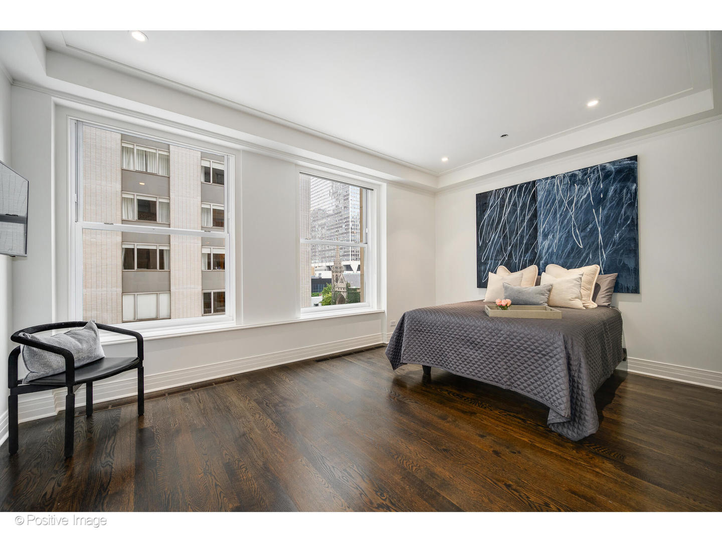 159 East Walton Place, Unit 7G Chicago, IL 60611 - Photo 28 of 37 a bedroom with furniture and a wooden floor