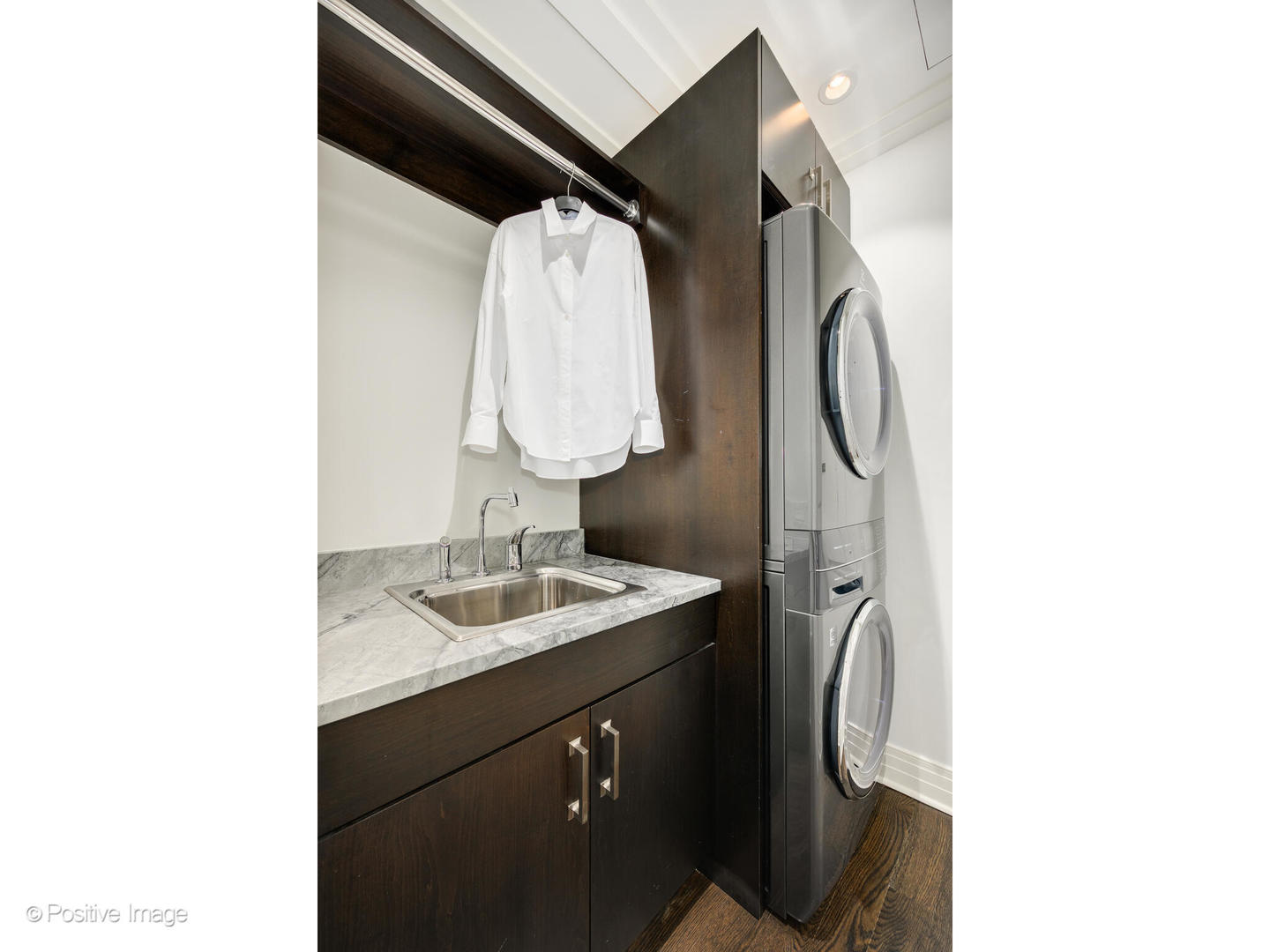 159 East Walton Place, Unit 7G Chicago, IL 60611 - Photo 31 of 37 a bathroom with a sink and mirror