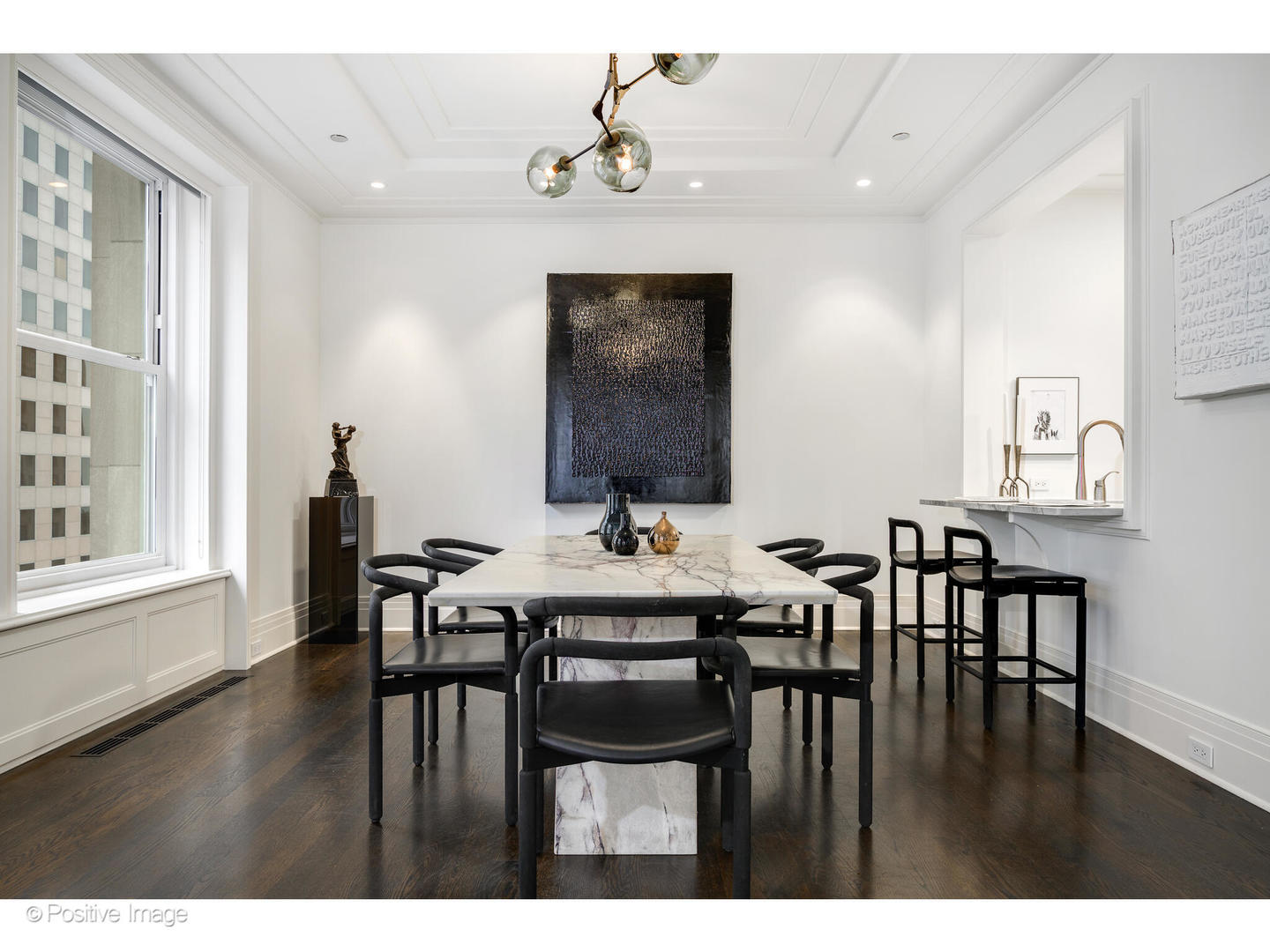 159 East Walton Place, Unit 7G Chicago, IL 60611 - Photo 10 of 37 a view of a dining room with furniture and wooden floor