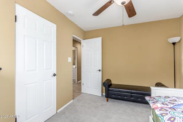 a bench sitting in a room next to a window