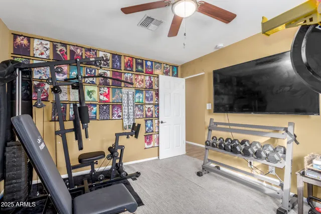 a living room with lots of furniture and a flat screen tv