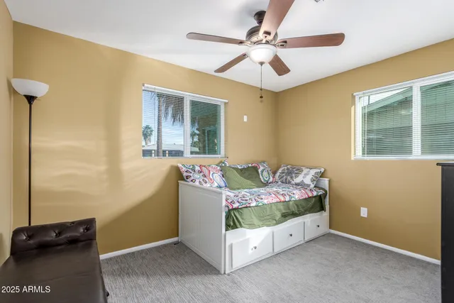 a bed room with a bed and a window