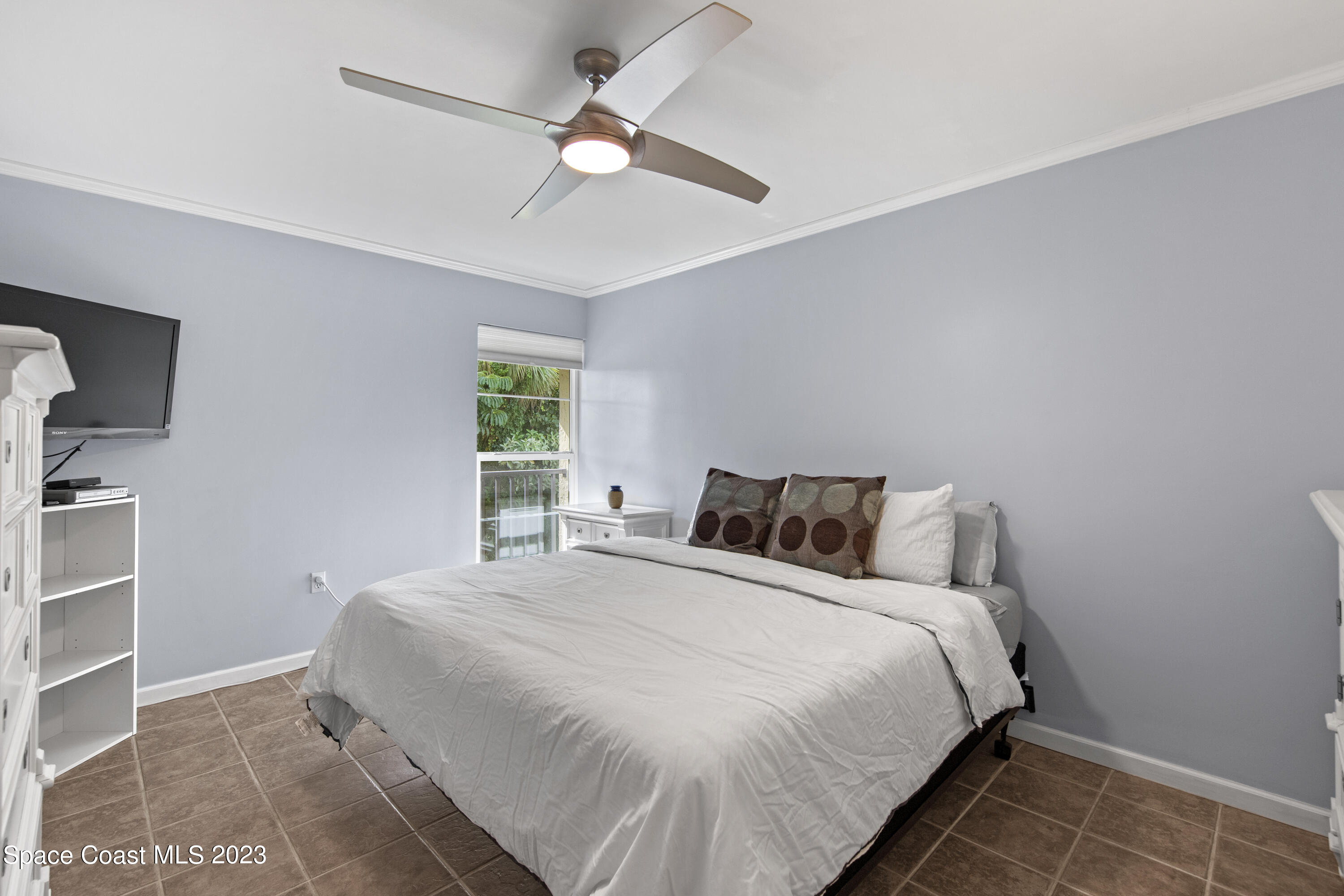 4150 Florida A1A, Unit 104 Vero Beach, FL 32963 - Photo 19 of 30 a bedroom with a bed and a window