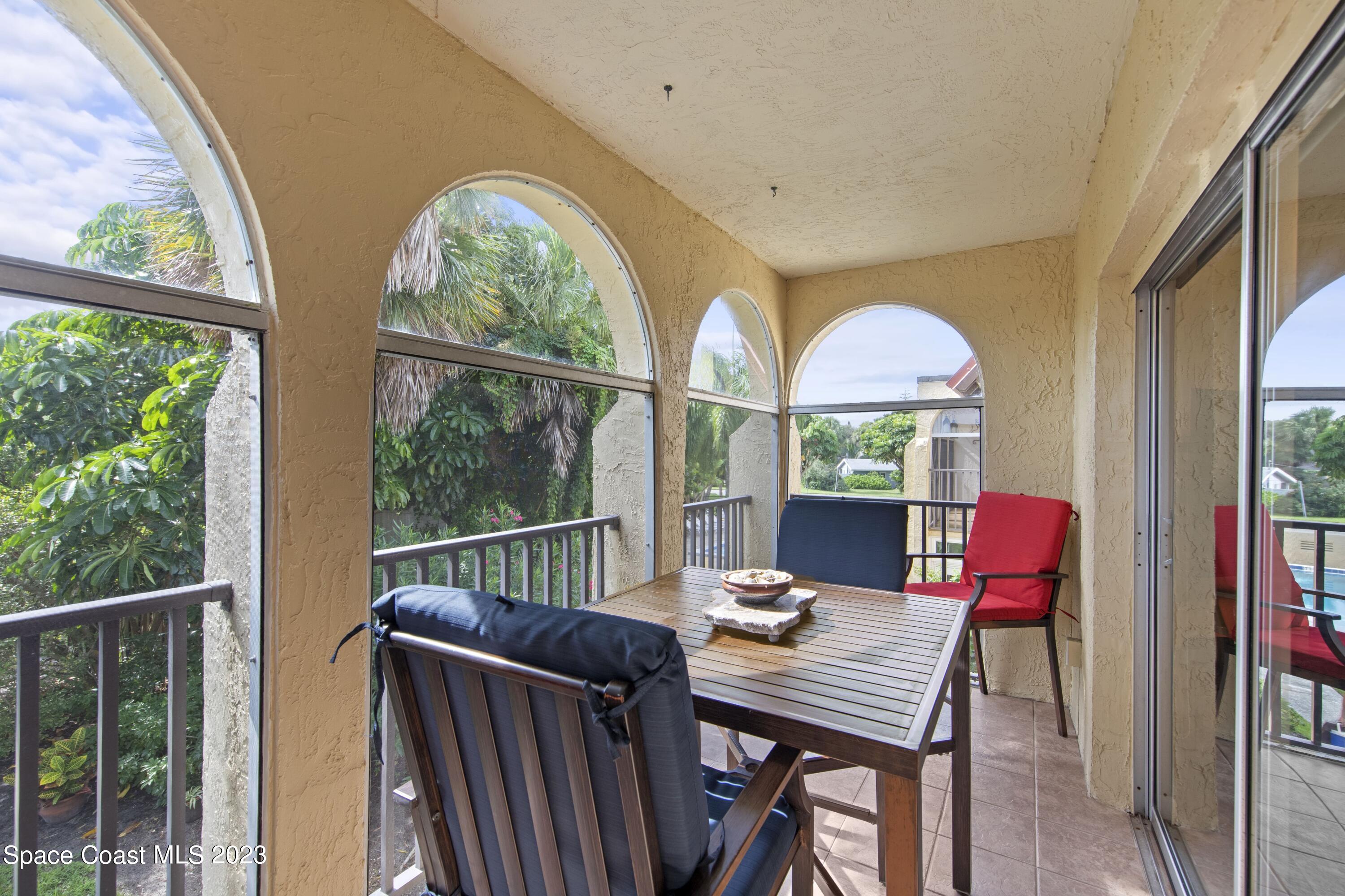 4150 Florida A1A, Unit 104 Vero Beach, FL 32963 - Photo 2 of 30 a view of a dining room with furniture window and wooden floor