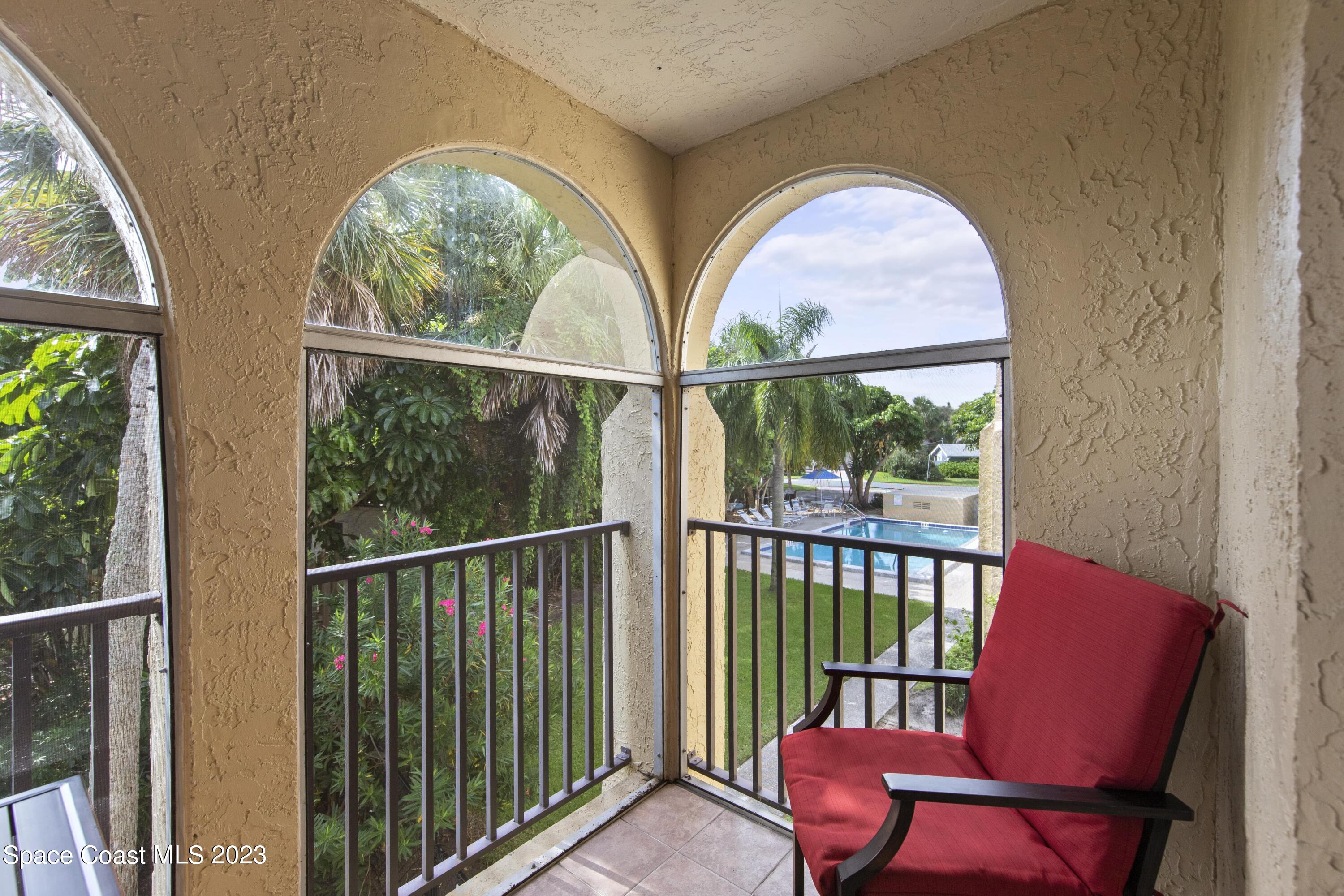 4150 Florida A1A, Unit 104 Vero Beach, FL 32963 - Photo 24 of 30 a view of a room with furniture large windows and garden view