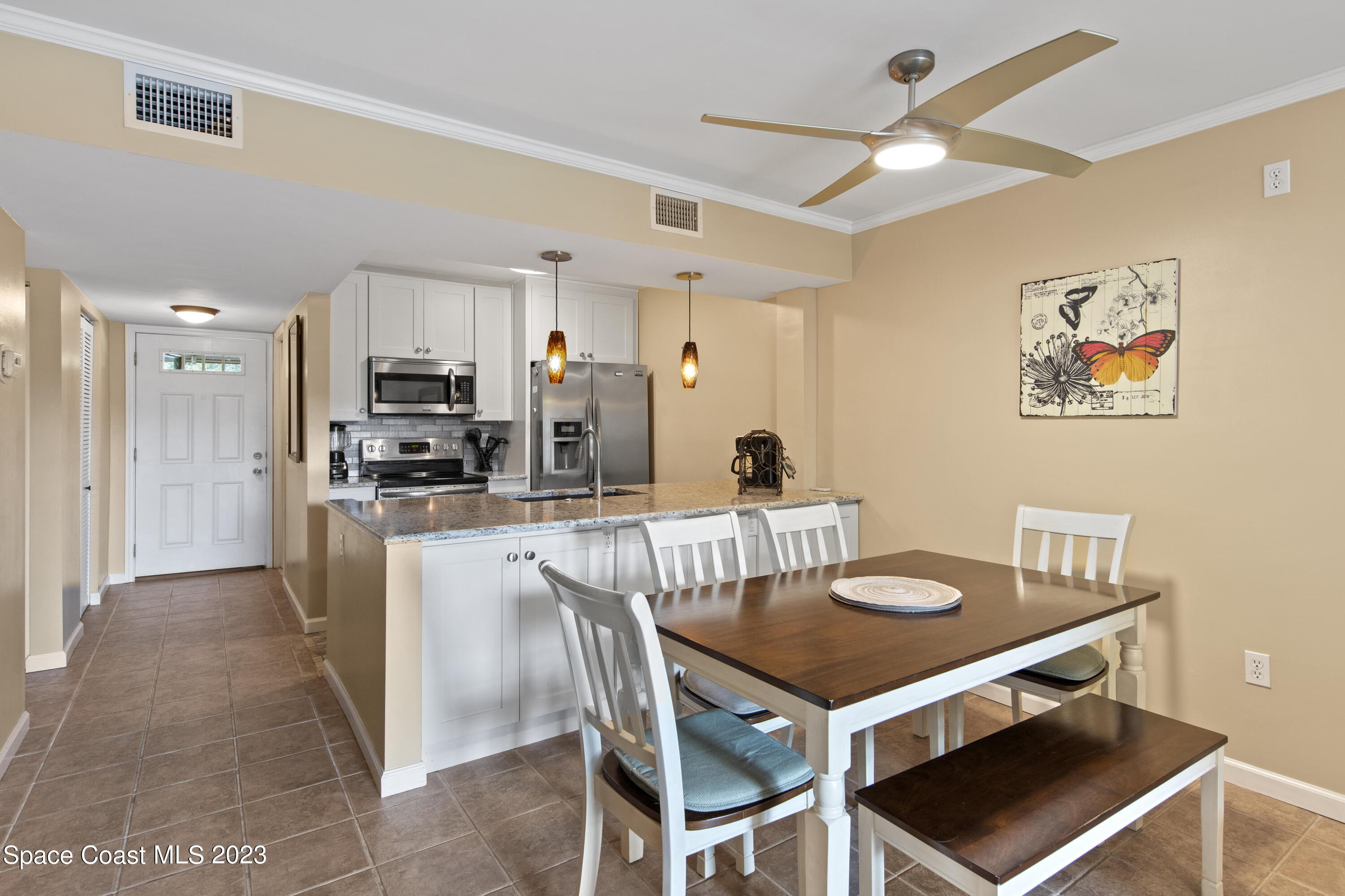 4150 Florida A1A, Unit 104 Vero Beach, FL 32963 - Photo 7 of 30 a view of a dining room with furniture