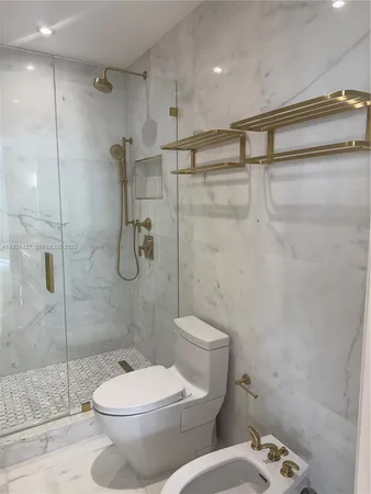 a bathroom with a tub and window