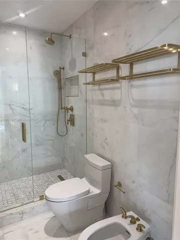 a bathroom with a tub and window