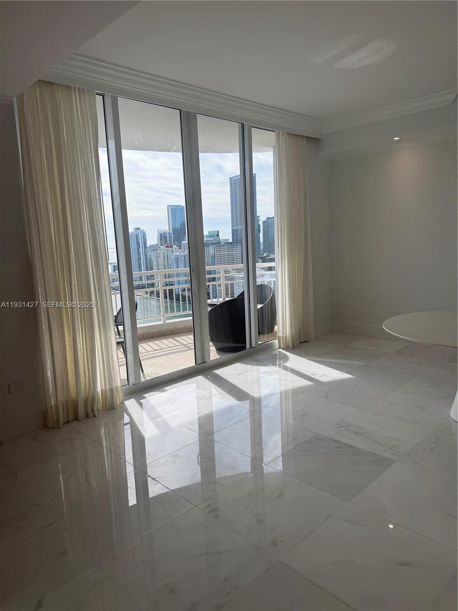 848 Brickell Key Drive, Unit PH4003 Miami, FL 33131 - Photo 2 of 12 a view of an empty room with a window