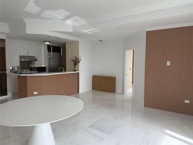 a view of kitchen with stainless steel appliances kitchen island