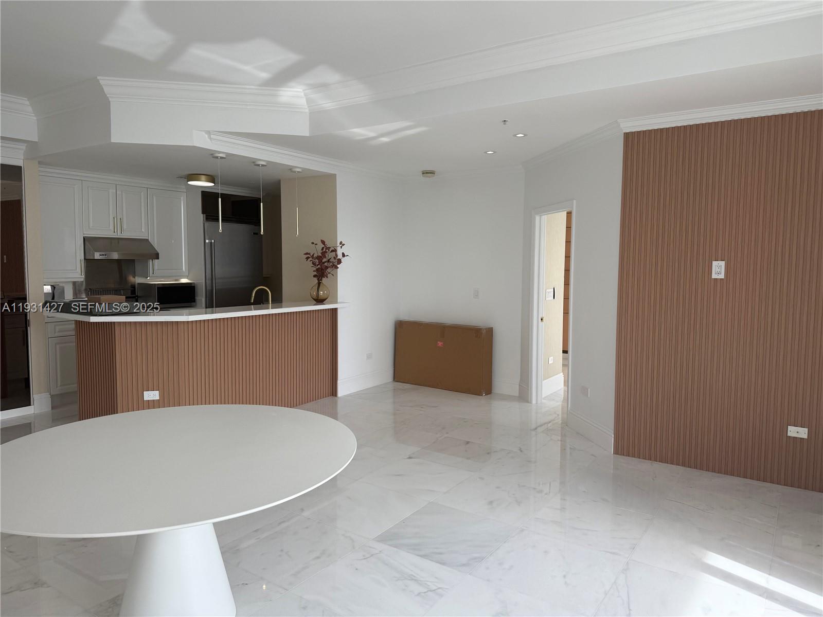 848 Brickell Key Drive, Unit PH4003 Miami, FL 33131 - Photo 5 of 12 a view of kitchen with stainless steel appliances kitchen island