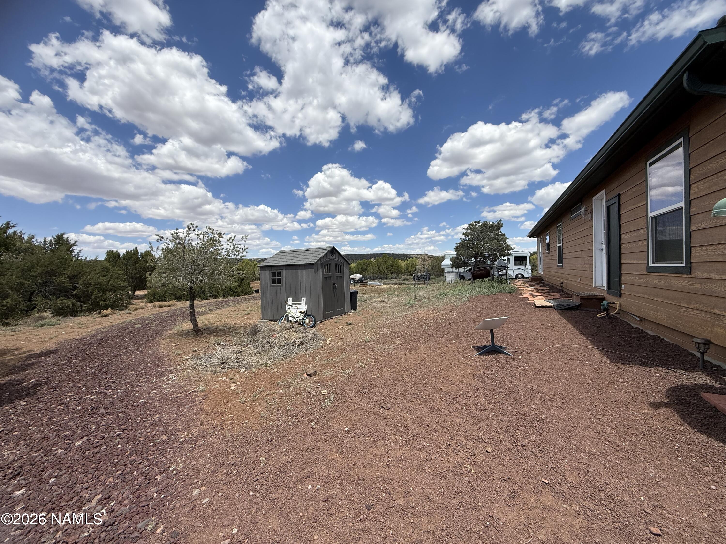 1431 East Cedar Road Williams, AZ 86046 - Photo 9 of 51 a view of a house with a yard
