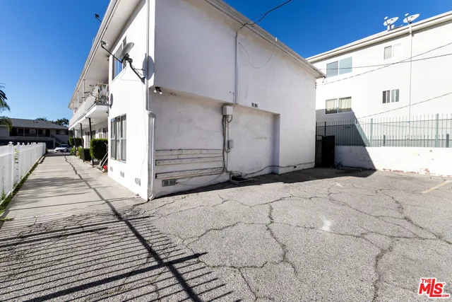 a view of a street with a building in the background
