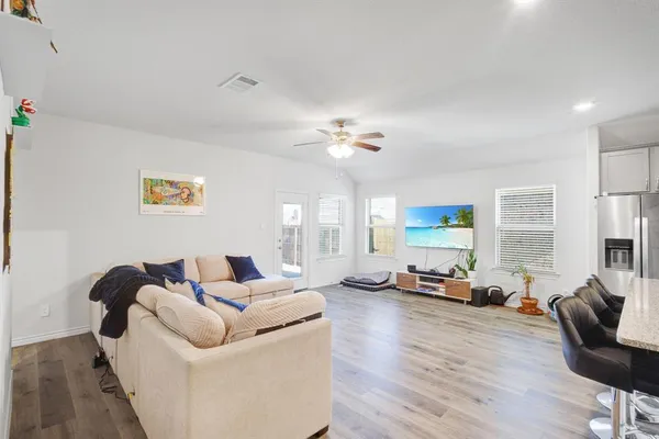 a living room with furniture or couch and a large window
