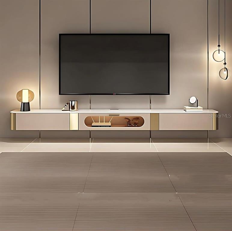 2700 North Atlantic Avenue, Unit 429 Daytona Beach, FL 32118 - Photo 6 of 11 a living room with a flat screen tv and a lamp