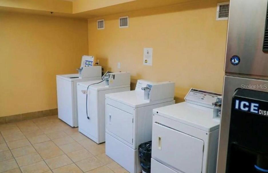 2700 North Atlantic Avenue, Unit 429 Daytona Beach, FL 32118 - Photo 9 of 11 a utility room with dryer and washer