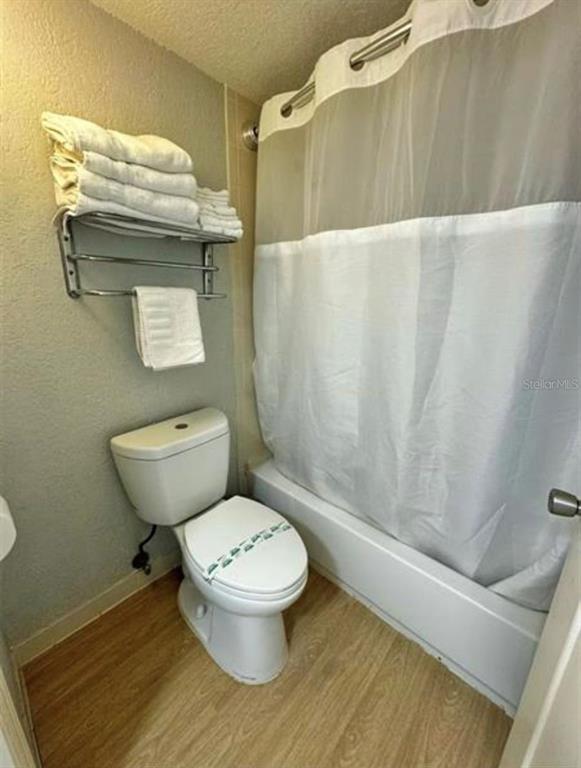 2700 North Atlantic Avenue, Unit 429 Daytona Beach, FL 32118 - Photo 10 of 11 a bathroom with a toilet and a shower