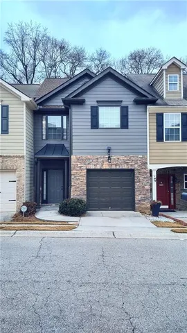 a front view of a house with yard