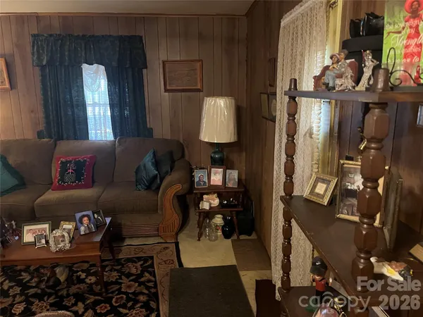 a room with furniture and flat screen tv