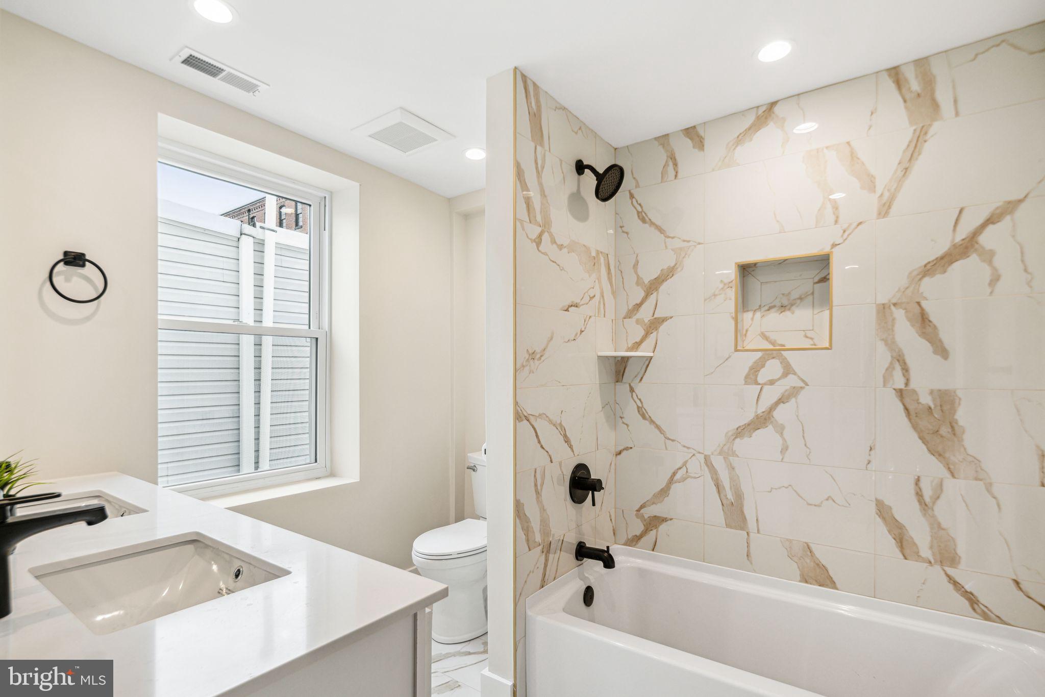1812 East Letterly Street Philadelphia, PA 19125 - Photo 11 of 26 a bathroom with a bathtub a sink and a shower