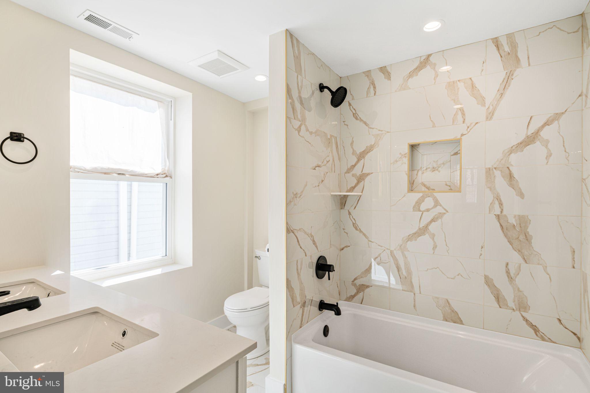 1812 East Letterly Street Philadelphia, PA 19125 - Photo 15 of 26 a bathroom with a bathtub and a shower