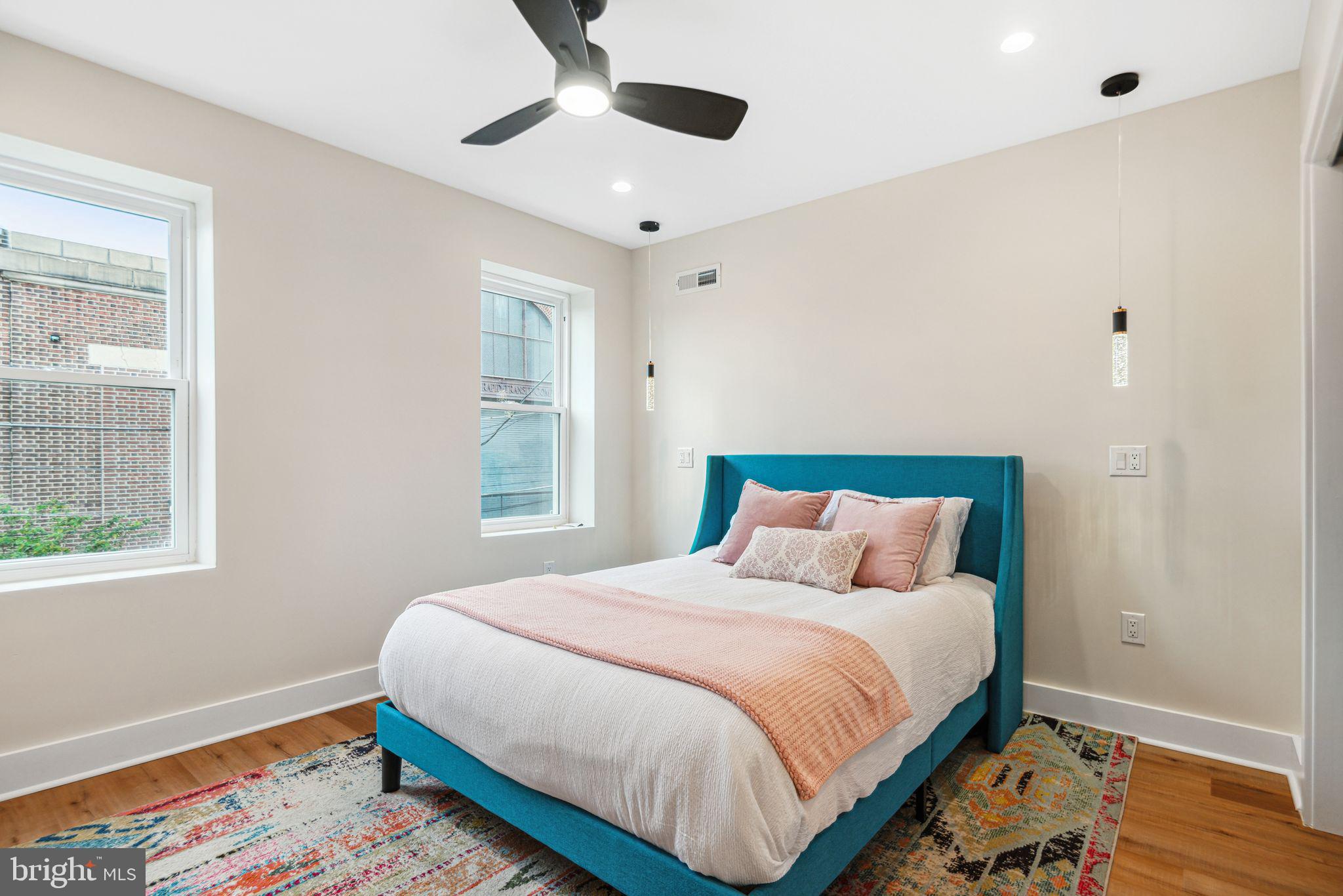 1812 East Letterly Street Philadelphia, PA 19125 - Photo 17 of 26 a bedroom with a large bed and a window