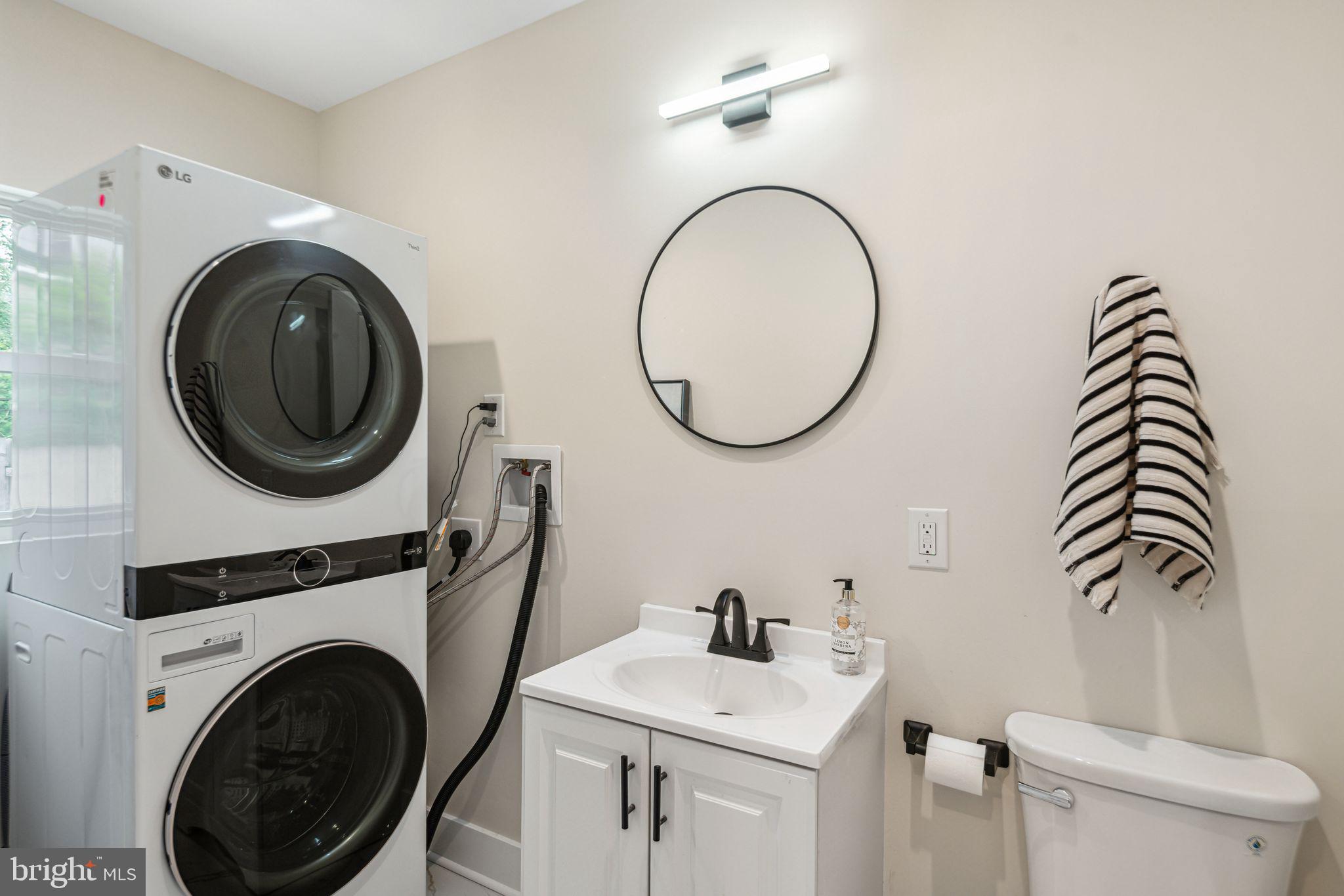 1812 East Letterly Street Philadelphia, PA 19125 - Photo 10 of 26 a bathroom with a sink mirror vanity and toilet