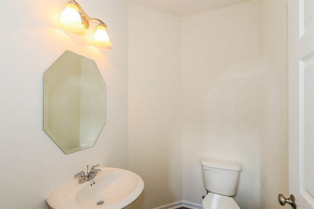2949 Madison Drive Naperville, IL 60564 - Photo 16 of 29 a bathroom with a toilet sink and mirror