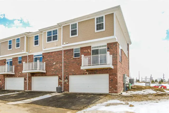 a front view of a building with a road