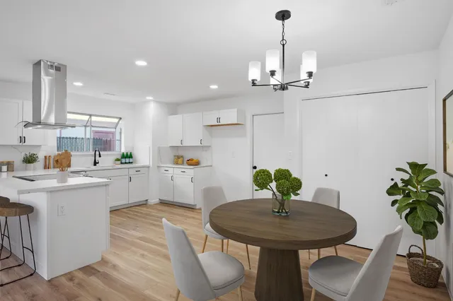 a kitchen with counter top space appliances and cabinets