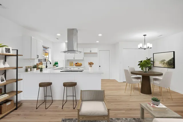a kitchen with a table and chairs