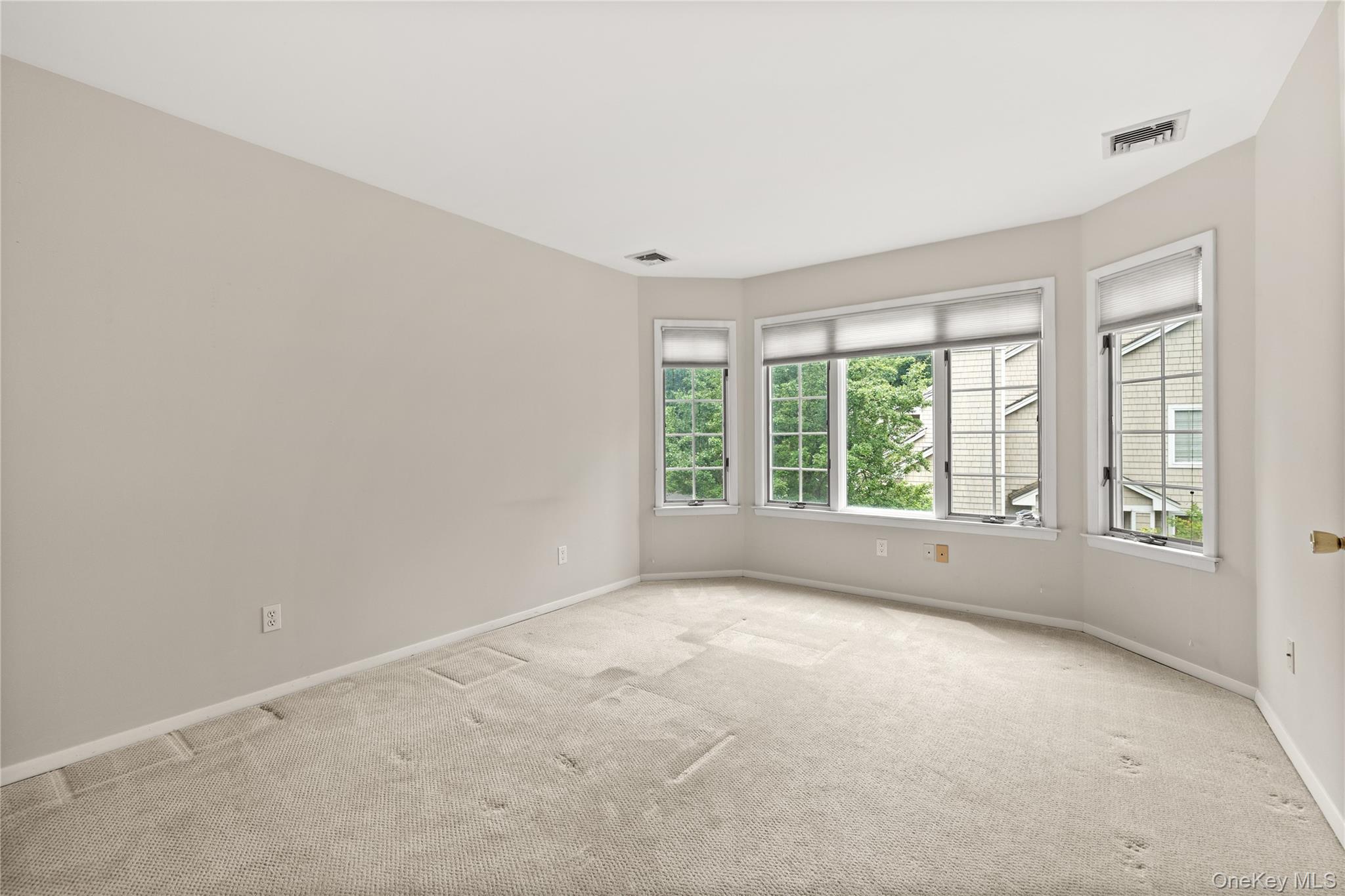 34 Cedar Ridge Lane Bay Shore, NY 11706 - Photo 16 of 27 a view of an empty room with a window
