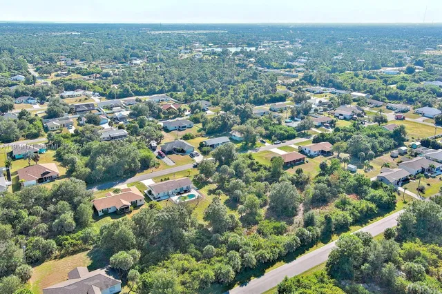 an aerial view of a city with lots of residential buildings