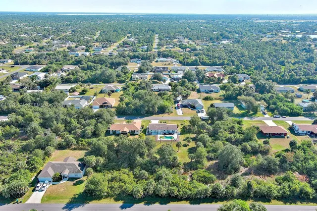an aerial view of a city with lots of residential buildings
