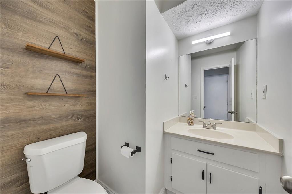 635 Anderson Walk Marietta, GA 30062 - Photo 16 of 39 a bathroom with a toilet sink and mirror