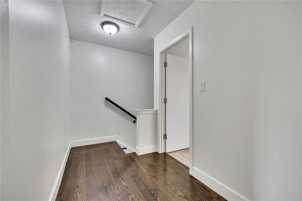 635 Anderson Walk Marietta, GA 30062 - Photo 18 of 39 a view of an empty room with wooden floor