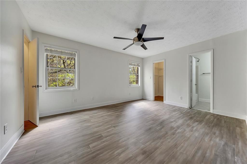 635 Anderson Walk Marietta, GA 30062 - Photo 19 of 39 a view of an empty room with window and wooden floor
