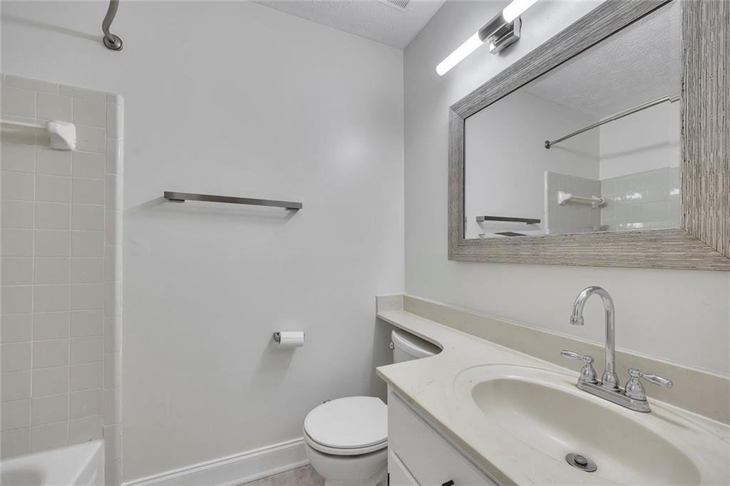 635 Anderson Walk Marietta, GA 30062 - Photo 22 of 39 a bathroom with a sink toilet and mirror