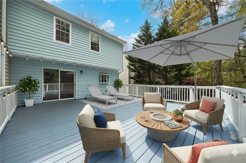 635 Anderson Walk Marietta, GA 30062 - Photo 30 of 39 a balcony with furniture and umbrella