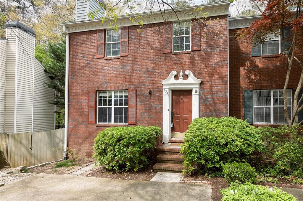 635 Anderson Walk Marietta, GA 30062 - Photo 3 of 39 front view of a brick house with a large window