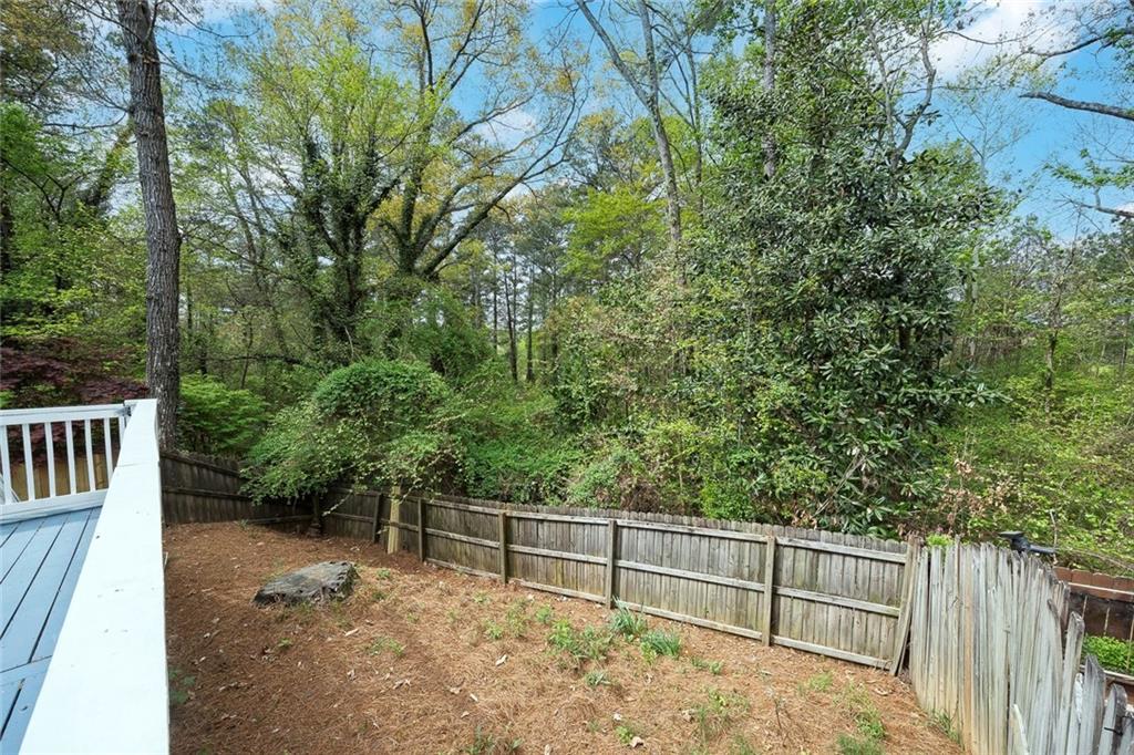 635 Anderson Walk Marietta, GA 30062 - Photo 34 of 39 a view of backyard with green space and wooden fence