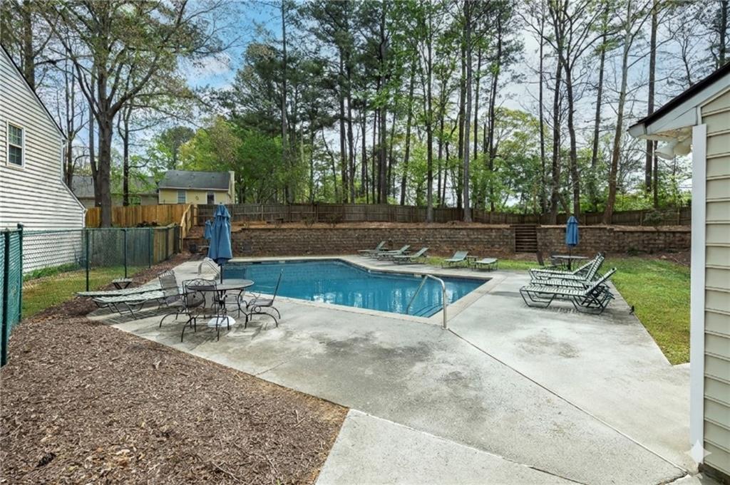 635 Anderson Walk Marietta, GA 30062 - Photo 38 of 39 a view of a patio with swimming pool