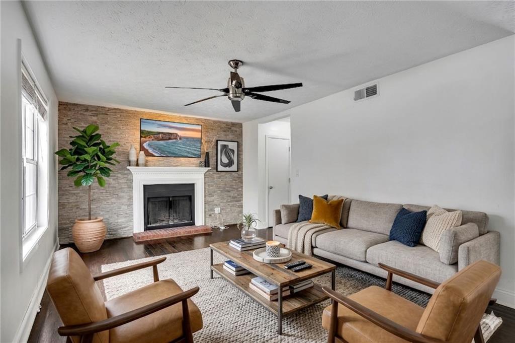 635 Anderson Walk Marietta, GA 30062 - Photo 7 of 39 a living room with furniture and a fireplace