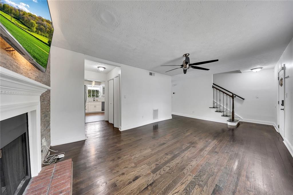 635 Anderson Walk Marietta, GA 30062 - Photo 9 of 39 a view of empty room with wooden floor and fan