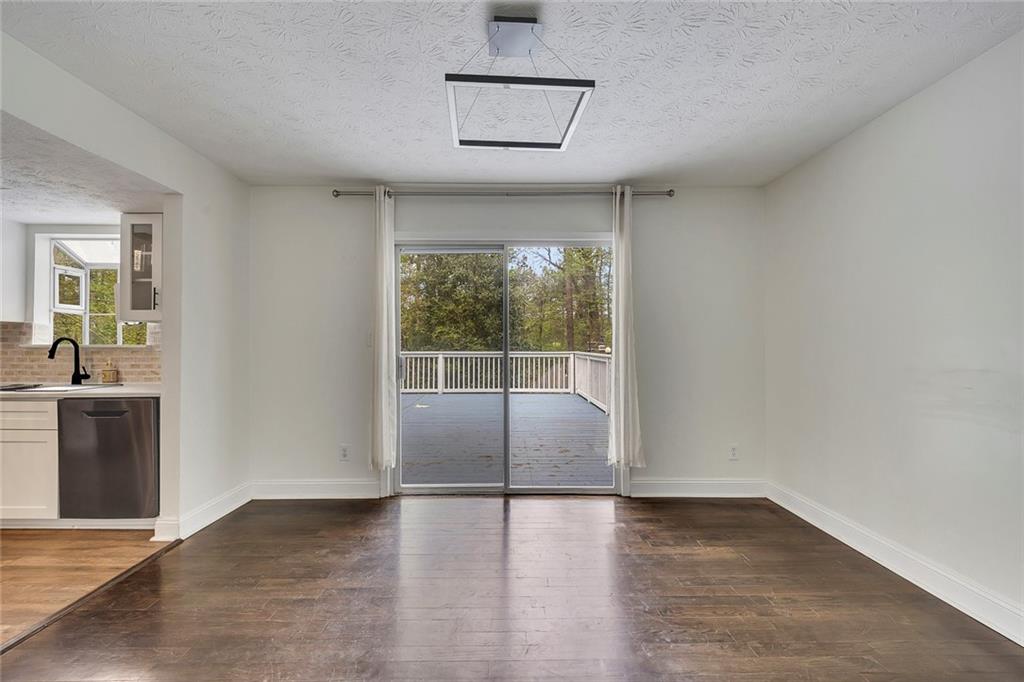 635 Anderson Walk Marietta, GA 30062 - Photo 10 of 39 an empty room with wooden floor and windows