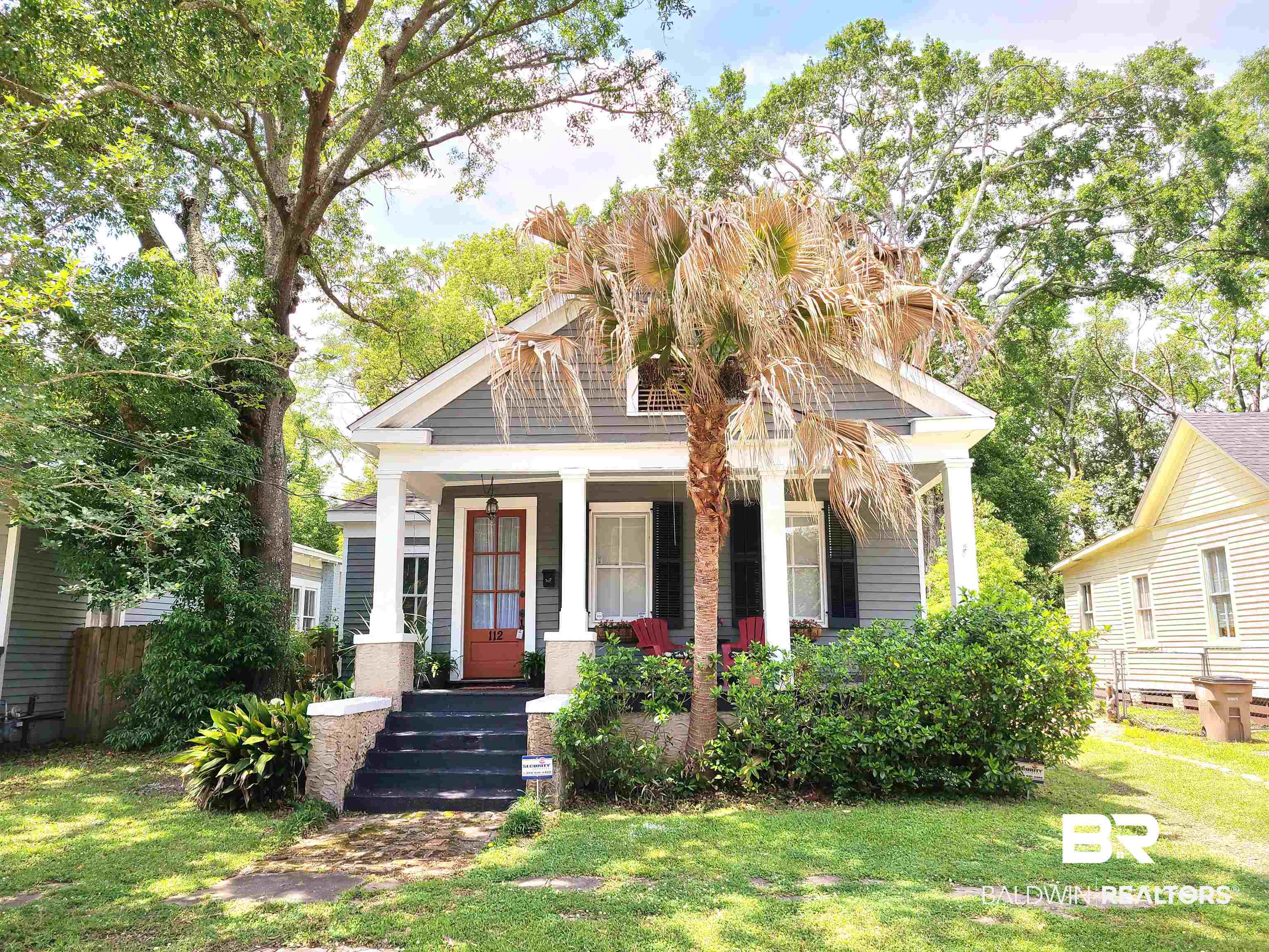 112 Espejo Street Mobile, AL 36604 - Photo 1 of 20 View of front of property featuring a porch and a front lawn