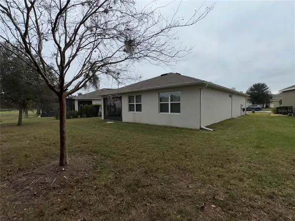 a house with trees in the background