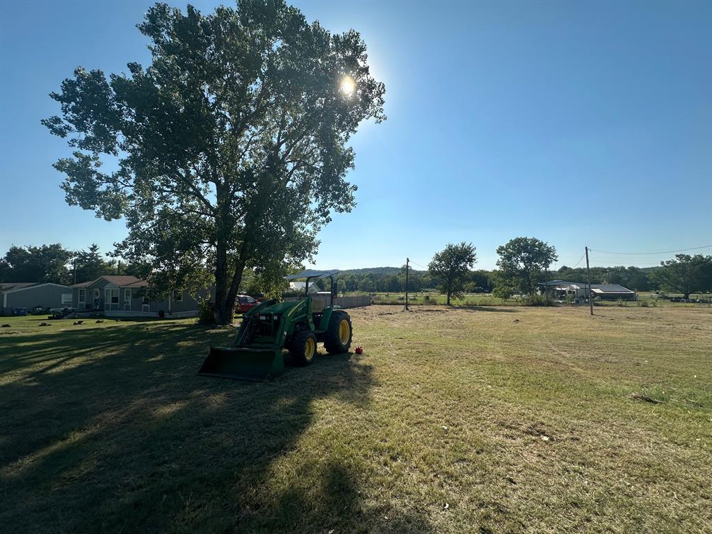 248 1st Street Oak Ridge, TX 76240 - Photo 2 of 7 a view of a lake with houses in background