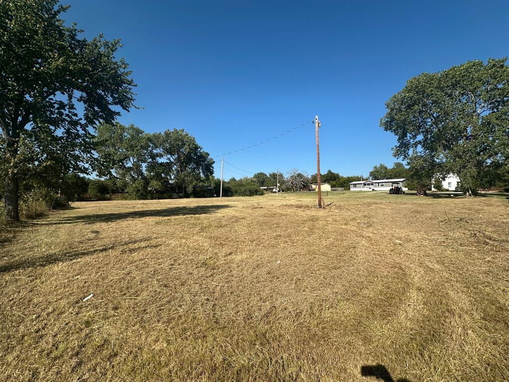 248 1st Street Oak Ridge, TX 76240 - Photo 7 of 7 a view of a pool with a yard