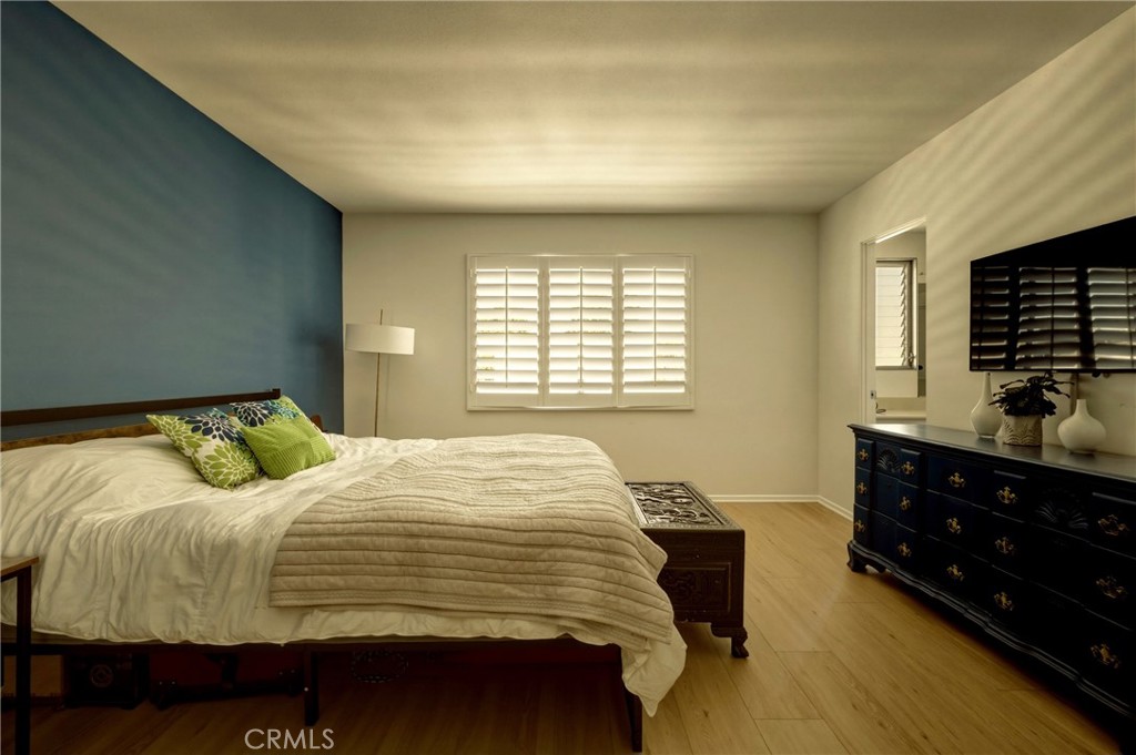 4331 West Sarah Street, Unit 10 Burbank, CA 91505 - Photo 18 of 26 a bedroom with a bed and a dresser